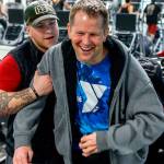 Firmly in the grip of his assistant, Kacey Walker, Stanwood&rsquo;s Todd Duitsman, who has been paralyzed since a 2014 body surfing accident on Maui, stands up from his wheelchair and attempts a step forward Wednesday at the Marysville YMCA. (Dan Bates / The Herald)