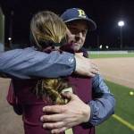 Father, daughter in opposite dugouts in softball game