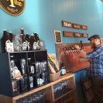 A server pours a beer at Chuckanut Brewery&rsquo;s South Nut location near the Skagit Airport. (Photo courtesy Chuckanut Brewery)