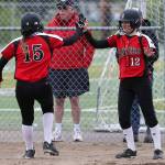 Snohomish&rsquo;s Elle Everett (right) high-fives teammate Rylie Wales after they scored during a game against Meadowdale on April 25 in Snohomish. (Andy Bronson / The Herald)