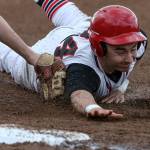 Snohomish&rsquo;s Josh Johnson slides safely to third base, tagged by an empty glove, as Snohomish beat Marysville Pilchuck 4-3 in extra innings of baseball on April 18, in Snohomish. (Andy Bronson / The Herald)