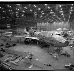 At the Boeing Co. Everett factory, workers assemble the main body pieces of the original 747 in May 1968. A month later, the company would begin testing the engine that Pratt & Whitney developed for the 747 on a B-52. (Photo Courtesy of The Boeing Co.)