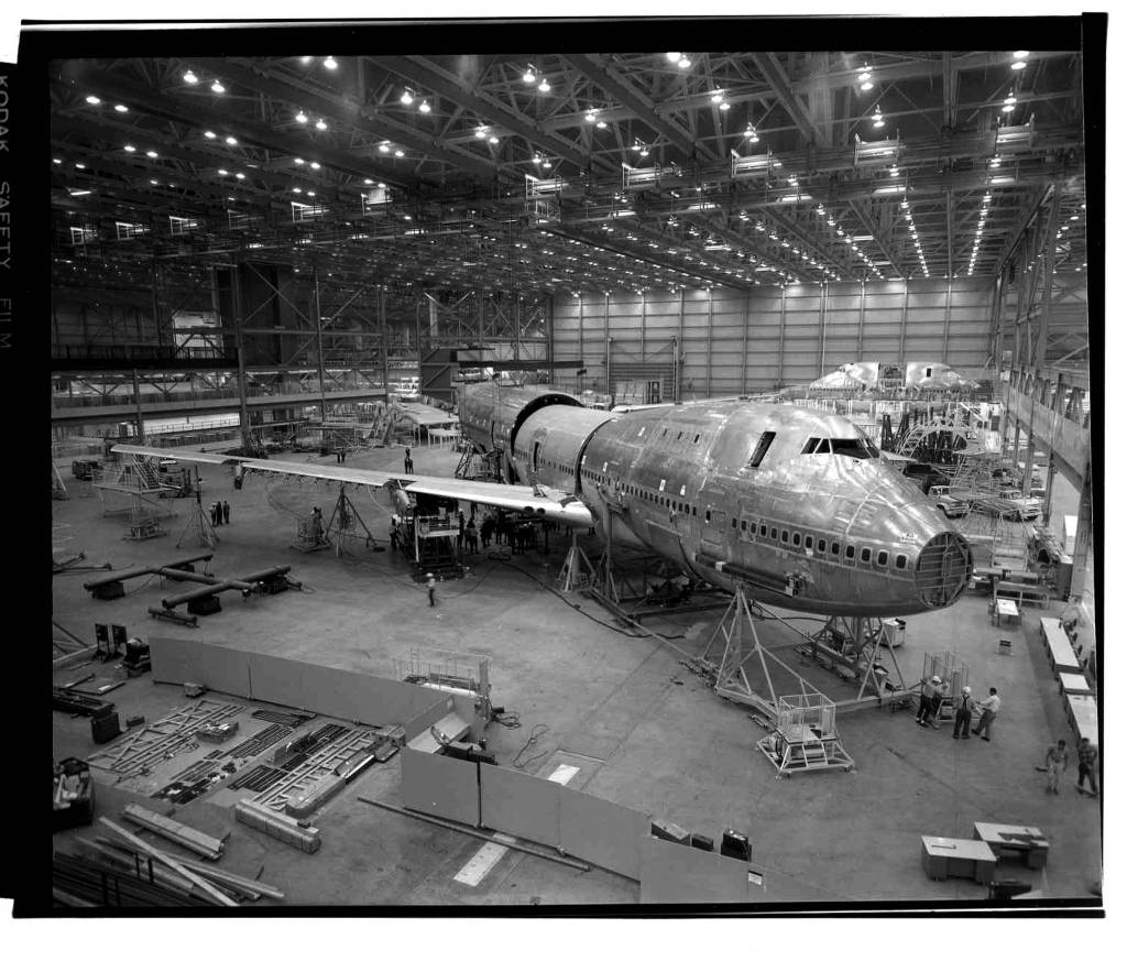 At the Boeing Co. Everett factory, workers assemble the main body pieces of the original 747 in May 1968. A month later, the company would begin testing the engine that Pratt & Whitney developed for the 747 on a B-52. (Photo Courtesy of The Boeing Co.)