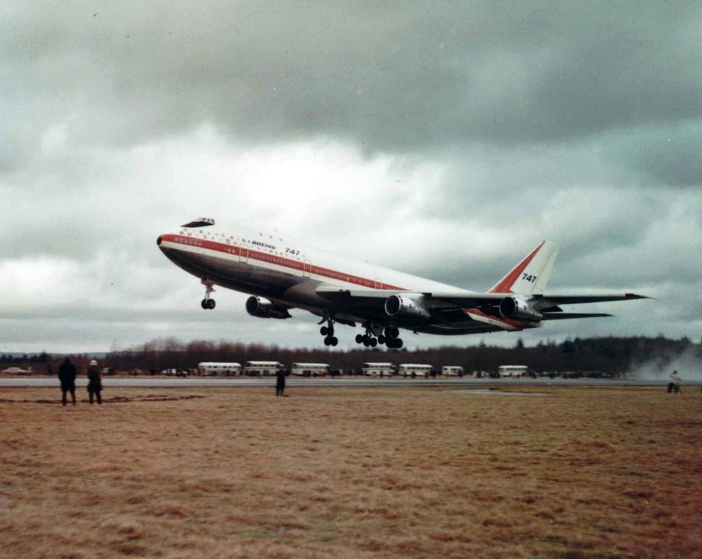 Spectators watch from the airfield as the prototype Boeing 747 (RA001) lifts into the air on its maiden flight at Everett&rsquo;s Paine Field on Feb. 9, 1969.