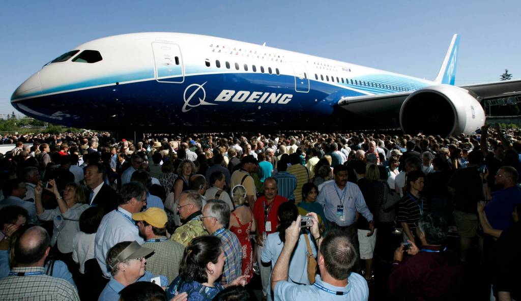 The first production model of the new Boeing 787 Dreamliner airplane is unveiled to an audience of several thousand employees, airline executives and dignitaries during a ceremony on July 8, 2007, at Boeing&rsquo;s assembly plant in Everett. The 787 is Boeing&rsquo;s first all-new plane since airlines started flying the 777 in 1995. Boeing has already booked more than 600 orders for the plane, which is promised to burn less fuel, be cheaper to maintain and offer more passenger comforts than comparable planes flying today. (AP Photo / Ted S. Warren)
