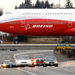 A Boeing 747-8 Intercontinental is being moved across Highway 526 from the assembly plant to the fuel dock on Feb. 13, 2011, in Everett. (Michael O&rsquo;Leary / The Herald)