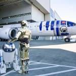 R2-D2 and C-3PO watch the unveiling of the R2-D2 themed 787 at Paine Field on Sept. 12, 2015. (Kevin Clark / The Herald)