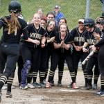 Lake Stevens players celebrate a home run by Sara Johnson (left) during a game against Jackson on May 2, 2017, at Jackson High School in Mill Creek. (Ian Terry / The Herald)