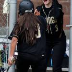 Lake Stevens&rsquo; Emma Fortney (right) celebrates a run by teammate Summer Scales during a game against Jackson on May 2, 2017, at Jackson High School in Mill Creek. (Ian Terry / The Herald)