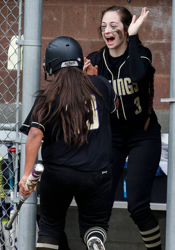 Lake Stevens&rsquo; Emma Fortney (right) celebrates a run by teammate Summer Scales during a game against Jackson on May 2, 2017, at Jackson High School in Mill Creek. (Ian Terry / The Herald)