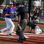Edmonds-Woodway&rsquo;s Julian Kodama (left) holds the ball out after tagging Snohomish&rsquo;s Jaden McClure at home plate during a 3A District 1 semifinal game on May 9, 2017, at Meridian Park Fields. (Ian Terry / The Herald)