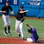 Snohomish&rsquo;s Isaac Everett (17) throws to first base as Edmonds-Woodway&rsquo;s Julian Kodama slides during a 3A District 1 semifinal game on May 9, 2017, at Meridian Park Fields. (Ian Terry / The Herald)