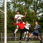 Lynnwood&rsquo;s Ryley Johnson collides with Squalicum goalkeeper Ricardo Solano during a 3A District 1 Tournament semifinal game on May 9, 2017, at Shoreline Stadium. Lynnwood beat Squalicum 2-1. (Ian Terry / The Herald)