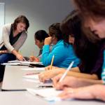Helping students with writing skills by creating resumes, Sara Stuart (left) teaches an advanced English for Speakers of Other Languages class in July, 2016 in Everett. The Casino Road Adult Education Academy is a partnership of YMCA, Seattle Goodwill and Edmonds Community College. (Andy Bronson / Herald file photo)