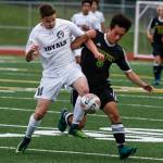 Lynnwood&rsquo;s Dane Evanger (left) fights for possession of the ball with Roosevelt&rsquo;s Mattias Cochard during a first round 3A state playoff game on May 17, 2017, at Edmonds Stadium. (Ian Terry / The Herald)