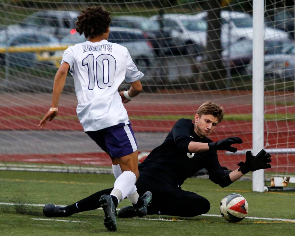 Todd Beamer goalkeeper Brandon Locke (right) stops a shot attempt by Kamiak&rsquo;s Andre&rsquo; Hamilton during a 4A state playoff game on May 19, 2017, at Goddard Stadium in Everett. Kamiak lost 2-1 in double overtime. (Ian Terry / The Herald)