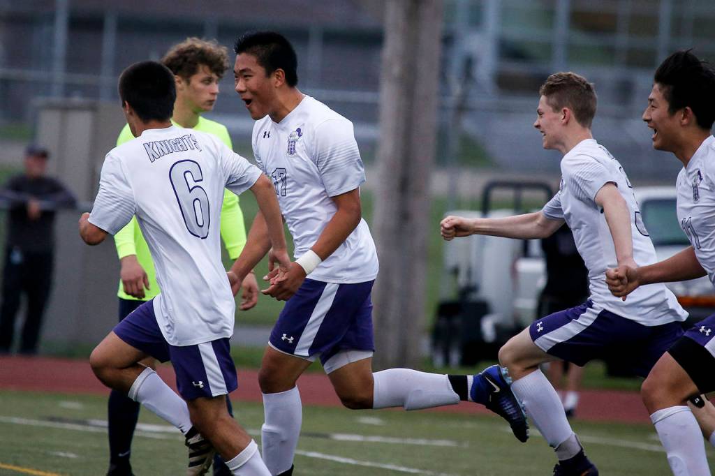 Kamiak&rsquo;s Jason Kim (center left) celebrates his goal in the first half of a 4A state playoff game against Todd Beamer on May 19, 2017, at Goddard Stadium in Everett. Kamiak lost 2-1 in double overtime. (Ian Terry / The Herald)