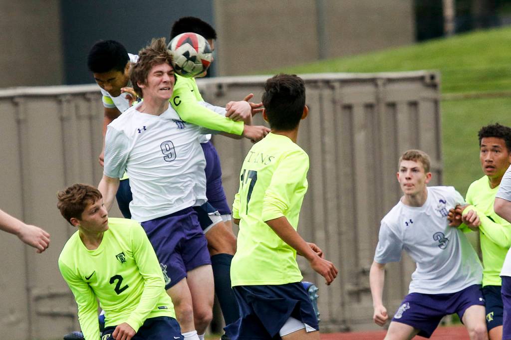 Kamiak&rsquo;s Soren Pehlivanian (9) heads the ball during a 4A state playoff game against Todd Beamer on May 19, 2017, at Goddard Stadium in Everett. Kamiak lost 2-1 in double overtime. (Ian Terry / The Herald)