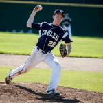 Arlington starting pitcher Owen Bishop delivers a pitch during a 3A state playoff game against Edmonds-Woodway on May 20, 2017, at Dream Field in Mount Vernon. (Ian Terry / The Herald)