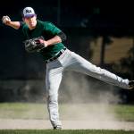 Edmonds-Woodway shortstop Brandon Mitchell makes a throw on the run during a team practice at the school on May 25, 2017. (Ian Terry / The Herald)