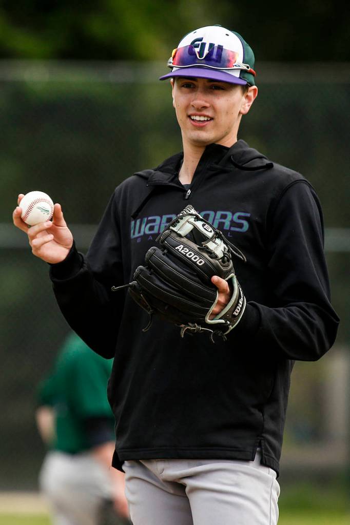 Edmonds-Woodway pitcher Nick Hull warms up his arm during a team practice at the school on May 25, 2017. (Ian Terry / The Herald)