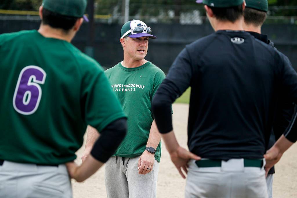Edmonds-Woodway head coach Dan Somoza (center) talks to his players during a team practice at the school on May 25, 2017. (Ian Terry / The Herald)