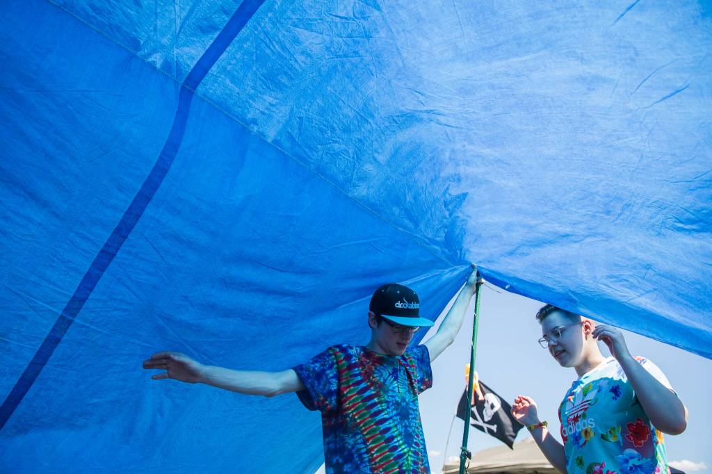 Sirius J (left) and Olivia Caron-Noble hang out in their tent on the first of three days during the annual Sasquatch! Music Festival on Friday, May 26, 2017 in George, Wa. (Daniella Beccaria / For the Herald )