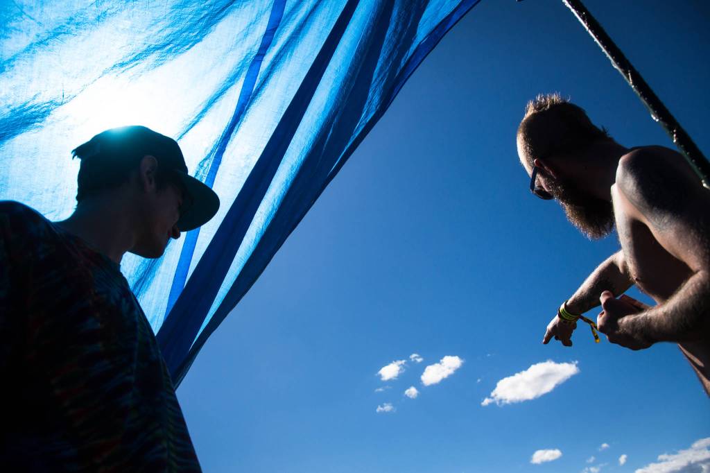 Sirius J (left) talks with a friend from the neighboring campsite on the first of three days during the annual Sasquatch! Music Festival on Friday, May 26, 2017 in George, Wa. (Daniella Beccaria / For the Herald )