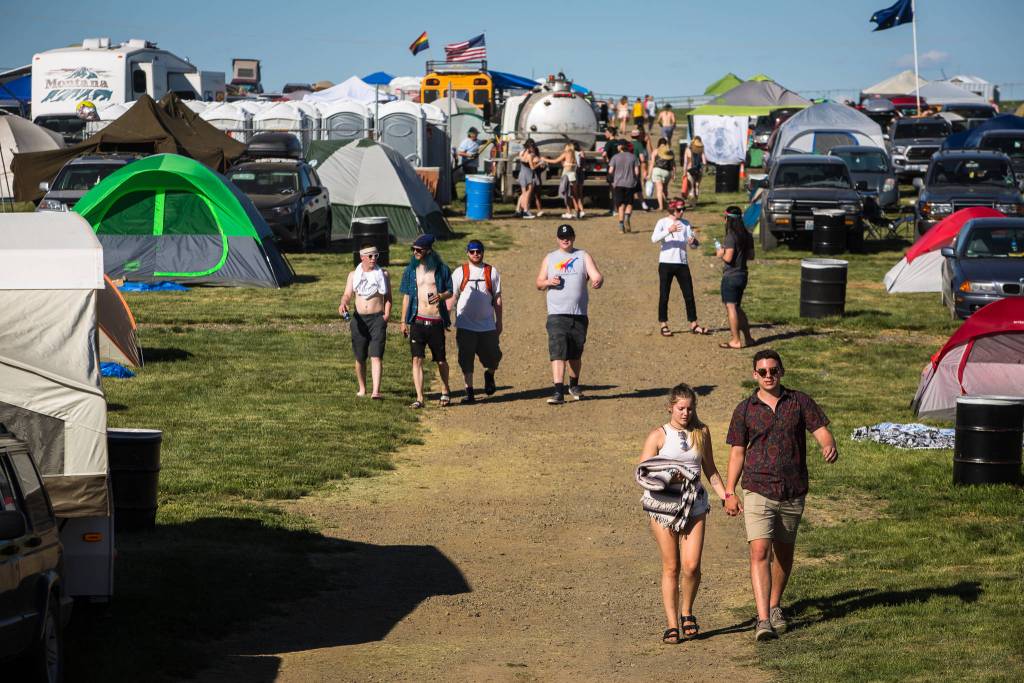 Festivalgoers make their way through the campgrounds on the first of three days during the annual Sasquatch! Music Festival on Friday, May 26, 2017 in George, Wa. (Daniella Beccaria / For the Herald )