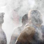 Festivalgoers cool off in the mist on the first of three days during the annual Sasquatch! Music Festival on Friday, May 26, 2017 in George, Wa. (Daniella Beccaria / For the Herald )