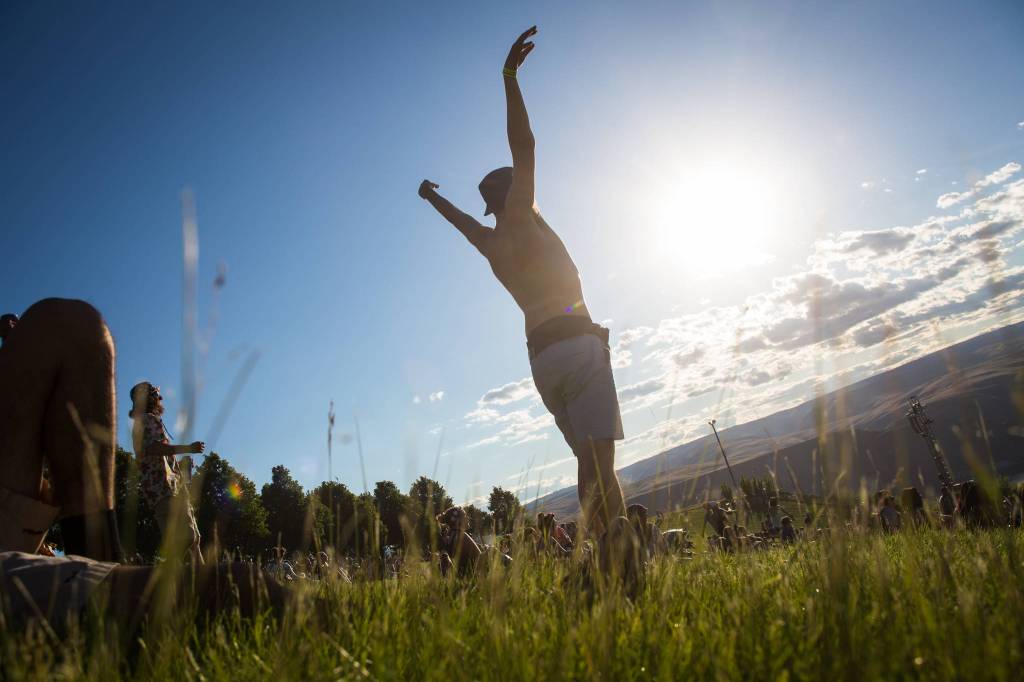 A festivalgoer dances on the hill near the main stage on the first of three days during the annual Sasquatch! Music Festival on Friday, May 26, 2017 in George, Wa. (Daniella Beccaria / For the Herald )