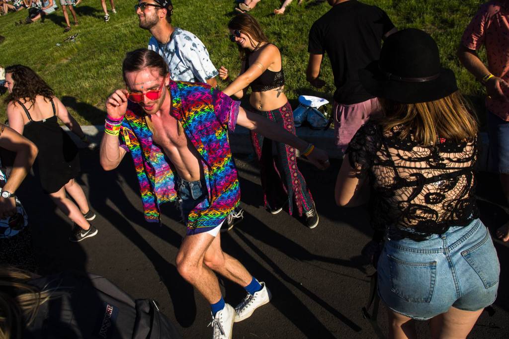 Festivalgoers dance on the hill near the main stage on the first of three days during the annual Sasquatch! Music Festival on Friday, May 26, 2017 in George, Wa. (Daniella Beccaria / For the Herald )