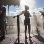 Festivalgoers cool off from the heat on the first of three days during the annual Sasquatch! Music Festival on Friday, May 26, 2017 in George, Wa. (Daniella Beccaria / For the Herald )
