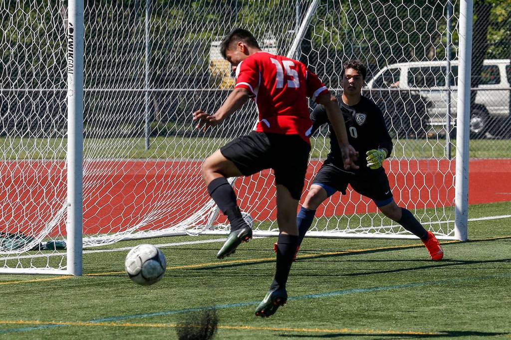 Snohomish&rsquo;s Eduardo Torralba-Barragan controls a ball in the box as Gig Harbor goalkeeper Winston Sappenfield looks on during a 3A state semifinal match on May 26, 2017, at Sparks Stadium in Puyallup. Snohomish beat Gig Harbor 4-3 to advance to the state championship game. (Ian Terry / The Herald)