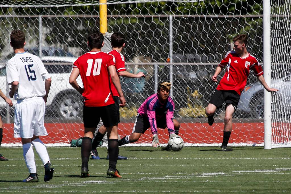 Snohomish goalkeeper Michael Herrera makes a save during a state 3A semifinal game against Gig Harbor on May 26, 2017, at Sparks Stadium in Puyallup. Snohomish beat Gig Harbor 4-3 to advance to the state championship game. (Ian Terry / The Herald)