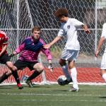 Snohomish goalkeeper Cole Strickland stretches out for a shot by Gig Harbor during a 3A state semifinal match on May 26, 2017, at Sparks Stadium in Puyallup. Snohomish beat Gig Harbor 4-3 to advance to the state championship game. (Ian Terry / The Herald)