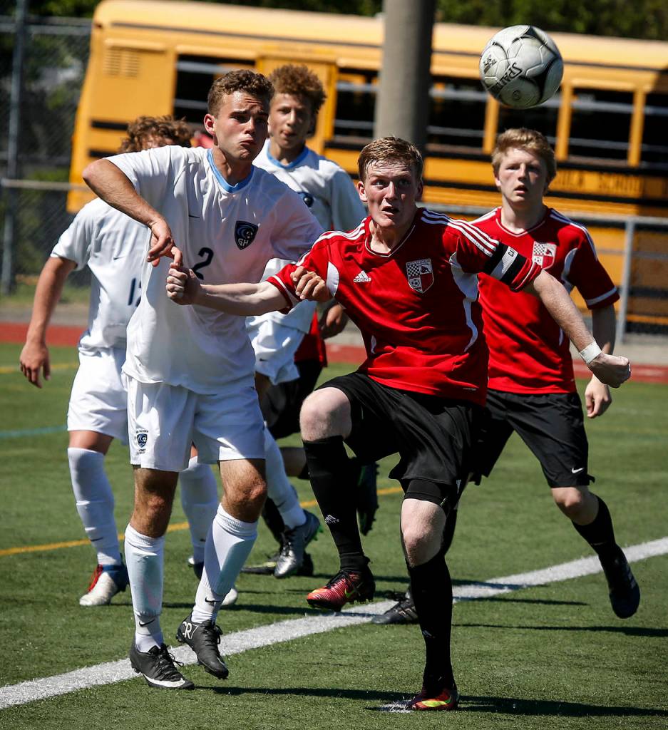 Snohomish&rsquo;s Jason Fairhurst (right) battles for position with Gig Harbor&rsquo;s Kenny Brooks during a 3A state semifinal game on May 26, 2017, at Sparks Stadium in Puyallup. Snohomish beat Gig Harbor 4-3 to advance to the state championship game. (Ian Terry / The Herald)