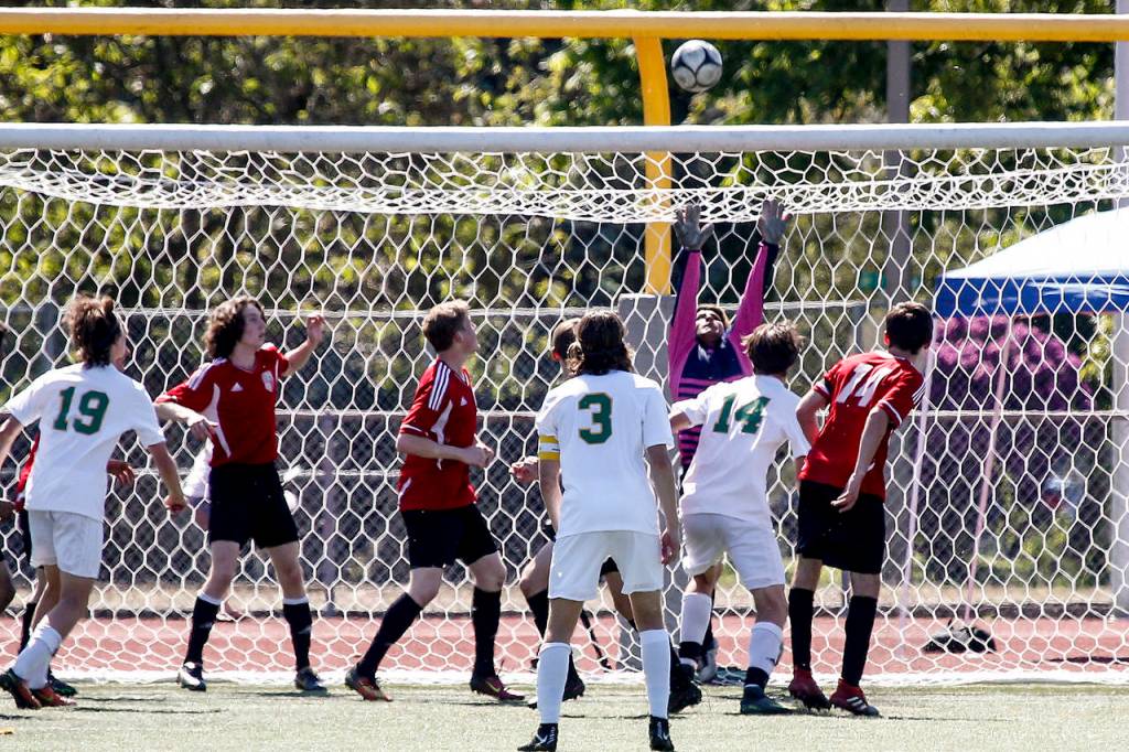 A ball sails above Snohomish goalkeeper Michael Herrera during the 3A State Championship at Sparks Stadium in Puyallup on Saturday, May 27. Roosevelt beat Snohomish 2-0. (Ian Terry / The Herald)