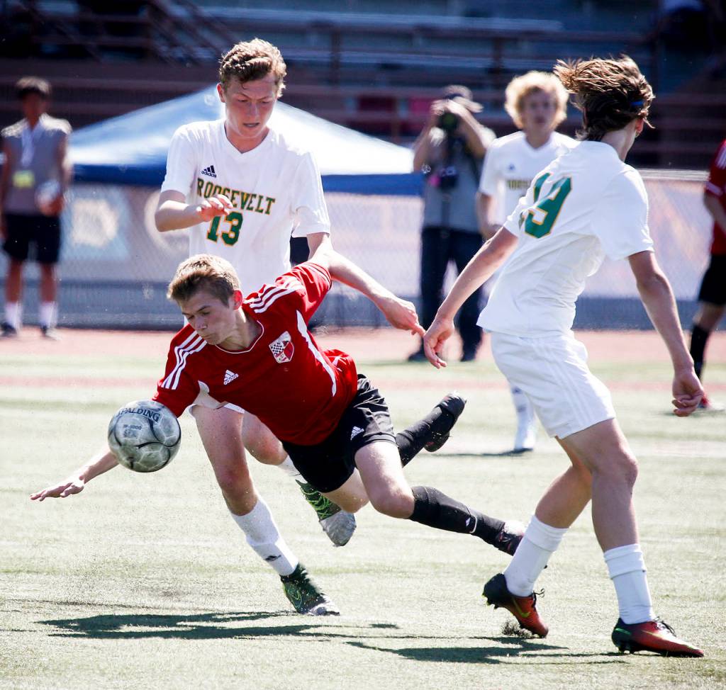 Snohomish&rsquo;s Conner Smith is knocked down during the 3A State Championship game against Roosevelt at Sparks Stadium in Puyallup on Saturday, May 27. Roosevelt beat Snohomish 2-0. (Ian Terry / The Herald)