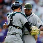 Seattle catcher Mike Zunino congratulates pitcher Edwin Diaz after the final out of Monday&rsquo;s game in Denver. (AP Photo/David Zalubowski)
