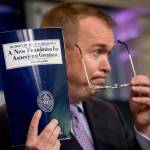 White House Budget Director Mick Mulvaney holds up a copy of President Donald Trump&rsquo;s proposed 2018 federal budget as he speaks to members of the media in the Press Briefing Room of the White House in Washington, D.C., Tuesday. (Associated Press)