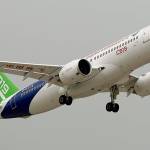 A Chinese C919 passenger jet takes off on its maiden flight at the Pudong International Airport in Shanghai on Friday. China is touting the C919 as a rival to the Airbus A320 and Boeing 737. The plane was originally due to fly in 2014 before being delivered to buyers in 2016, but has been beset by delays blamed on manufacturing problems. (Chinatopix Via AP)