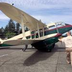 Volunteers at the Historic Flight Foundation wheel out the newest addition to the collection, a de Havilland Dragon Rapide. The wood-and-fabric airplane was a popular airliner in the 1930s and saw extensive military service with the Royal Air Force during World War II. Only 12 of the 731 built remain. (Dan Catchpole / The Herald)