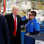 President-elect Donald Trump visited with workers during a visit to the Carrier factory Dec. 1, 2016, in Indianapolis. (AP Photo/Evan Vucci)