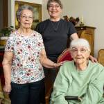Myrt Imus, center, is a senior companion to Lois Larson and Nadine Dobbins, residents of the Meadows II in Everett.(Andy Bronson / The Herald)