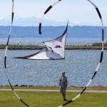 Jim Dygert of Lynnwood flies his dual-line stunt kite at Boxcar Park in Everett on Monday. &ldquo;You&rsquo;d have to go to the coast for a better place to fly,&rdquo; he said. (Andy Bronson / The Herald)