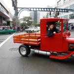 An old pickup truck rounds the intersection of Colby and Hewitt during the Cruzin&rsquo; To Colby event May, 26, 2013, in downtown Everett. Dozens of volunteers have saved the Cruzin&rsquo; to Colby car show from cancellation this year. (Herald file)