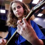 Music prodigy Elijah Croyle, 14, practices on an electric guitar at Valley View Middle School in Snohomish. He recently wrote a breezy Brazilian-style jazz samba, which was performed in March by a professional jazz band in Seattle. Elijah was there to explain his work. (Dan Bates / The Herald)