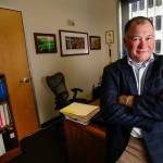 Josh Dugan, formerly with the Navy, but now a manager in the Snohomish County planning department, proposed a change in state law that helps military veterans transition to county jobs following their Navy career and saving considerable stress and financial difficulty in the process. Gov. Jay Inslee recently signed the changes into law. (Dan Bates / The Herald)