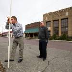 Landscape Architecture&rsquo;s Scott Lankford teaches Lee Ohlde how to shoot elevation measurements along 270th St. NW, one of many areas of Stanwood that lie in the flood zone, on Monday, May 15, 2017 in Stanwood, Wa. (Andy Bronson / The Herald)